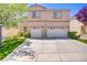 Charming two-story home with two-car garage and a well-manicured lawn at 8913 Loggers Mill Ave, Las Vegas, NV 89143
