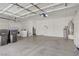 Spacious garage with high ceilings, built-in storage, and washer/dryer hookups at 8913 Loggers Mill Ave, Las Vegas, NV 89143