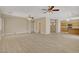 Bright living room with tile floors, ceiling fans, and plenty of natural light at 8913 Loggers Mill Ave, Las Vegas, NV 89143