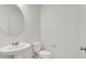 Bathroom featuring a pedestal sink and toilet at 9198 Harbin Ave, Las Vegas, NV 89148