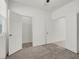 A room with carpet, a fan and two closets at 9198 Harbin Ave, Las Vegas, NV 89148