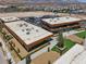 Aerial shot of modern commercial buildings with ample parking and landscaping in a vibrant area at 9198 Harbin Ave, Las Vegas, NV 89148