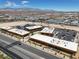 Extensive view of local commercial buildings and neighborhood from an aerial perspective at 9198 Harbin Ave, Las Vegas, NV 89148