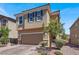 Two-story home with a paved driveway and a two-car garage at 9198 Harbin Ave, Las Vegas, NV 89148