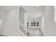 Bright hallway with tile flooring, staircase, and lots of natural light at 9198 Harbin Ave, Las Vegas, NV 89148