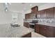 Modern kitchen with granite countertops and stainless steel appliances at 9198 Harbin Ave, Las Vegas, NV 89148