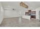 Open-concept kitchen features granite countertops, stainless steel appliances, and a spacious island at 9198 Harbin Ave, Las Vegas, NV 89148