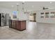 Modern kitchen with stainless steel appliances and tile floors at 9198 Harbin Ave, Las Vegas, NV 89148