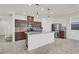 Kitchen features granite counters, stainless appliances, and a breakfast bar island at 9198 Harbin Ave, Las Vegas, NV 89148