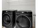 A laundry room featuring front load washer and dryer at 9198 Harbin Ave, Las Vegas, NV 89148