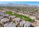 Aerial view of the community with a golf course and mountain views at 9201 Tesoras Dr # 302, Las Vegas, NV 89144