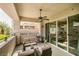 Large balcony with ceiling fan and seating area overlooking landscaped common area at 9201 Tesoras Dr # 302, Las Vegas, NV 89144