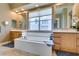 Bright bathroom featuring double vanity, large tub, and separate shower at 9201 Tesoras Dr # 302, Las Vegas, NV 89144