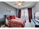 Bedroom with carpet flooring, red patterned bedding, a sliding glass door, and gray painted walls at 9201 Tesoras Dr # 302, Las Vegas, NV 89144