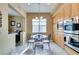 Bright breakfast nook featuring a glass table, large window, and built-in cabinets at 9201 Tesoras Dr # 302, Las Vegas, NV 89144