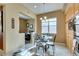 Bright breakfast nook featuring a glass table, large window, and built-in cabinets at 9201 Tesoras Dr # 302, Las Vegas, NV 89144