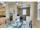 Dining room with a glass table, black chairs, and view of the office and living room at 9201 Tesoras Dr # 302, Las Vegas, NV 89144