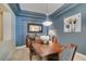 Cozy dining room with a lovely light fixture at 9201 Tesoras Dr # 302, Las Vegas, NV 89144