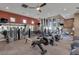 Community gym with high ceilings, carpet flooring, and many different machines at 9201 Tesoras Dr # 302, Las Vegas, NV 89144