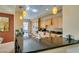 Well-equipped kitchen featuring granite counters and a breakfast bar with pendant lighting at 9201 Tesoras Dr # 302, Las Vegas, NV 89144