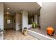 Beautifully adorned lobby with tile flooring, decorative plants and rock garden area at 9201 Tesoras Dr # 302, Las Vegas, NV 89144