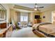 Spacious main bedroom with carpet flooring, a ceiling fan, a tray ceiling, and neutral paint at 9201 Tesoras Dr # 302, Las Vegas, NV 89144