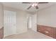 Spare bedroom with brick accent wall and ceiling fan at 9537 Michelle Falls Ave, Las Vegas, NV 89149