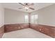 Spare bedroom with brick accent wall and ceiling fan at 9537 Michelle Falls Ave, Las Vegas, NV 89149