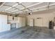 Spacious garage featuring ample cabinet storage and a large refrigerator at 9537 Michelle Falls Ave, Las Vegas, NV 89149