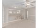 Carpeted upstairs loft space with stairs and ceiling fan at 9537 Michelle Falls Ave, Las Vegas, NV 89149