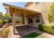 Outdoor patio with a covered area and sliding glass door entrance at 9537 Michelle Falls Ave, Las Vegas, NV 89149