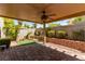 Outdoor patio featuring a fan and mature greenery at 9537 Michelle Falls Ave, Las Vegas, NV 89149