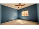 Comfortable bedroom with cozy carpet, ceiling fan, and natural light at 988 Upper Meadows Pl, Henderson, NV 89052