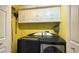 Convenient laundry room with front loading washer and dryer and lots of storage at 988 Upper Meadows Pl, Henderson, NV 89052