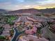 Panoramic aerial view of the neighborhood displaying the surrounding mountains, golf course, and community layout at 1 Cerchio Basso, Henderson, NV 89011