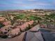 Stunning aerial view of a desert community with lush golf course and mountain views at 1 Cerchio Basso, Henderson, NV 89011