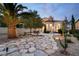 Beautiful backyard with palm trees, lovely patio and stunning architectural features at 1 Cerchio Basso, Henderson, NV 89011
