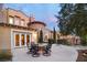 Backyard patio with wrought iron chairs, lovely landscaping and stunning architectural features at 1 Cerchio Basso, Henderson, NV 89011