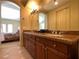 Bathroom featuring double sinks with granite counters and access to bedroom at 1 Cerchio Basso, Henderson, NV 89011