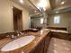 Elegant bathroom featuring double sinks with granite countertops and walk-in closet at 1 Cerchio Basso, Henderson, NV 89011