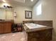 Relaxing bathroom with a soaking tub encased in granite, offering a spa-like retreat at 1 Cerchio Basso, Henderson, NV 89011