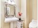 Stylish powder room with a pedestal sink and decorative accents at 1 Cerchio Basso, Henderson, NV 89011