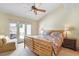 Inviting bedroom with a patio and a comfortable armchair at 1 Cerchio Basso, Henderson, NV 89011