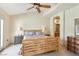 Bright bedroom with a ceiling fan and a view of the bathroom at 1 Cerchio Basso, Henderson, NV 89011
