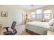 Light and airy bedroom with carpet flooring, and a view from the windows at 1 Cerchio Basso, Henderson, NV 89011
