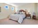 Comfortable bedroom with carpet floors, natural light, and side tables at 1 Cerchio Basso, Henderson, NV 89011