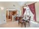 Charming dining space with a kitchen view and elegant chandelier at 1 Cerchio Basso, Henderson, NV 89011