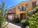 Inviting two-story home with desert landscaping, showcasing a charming exterior with a small balcony at 1 Cerchio Basso, Henderson, NV 89011