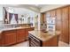 Kitchen featuring wood cabinets, granite countertops and stainless steel appliances at 1 Cerchio Basso, Henderson, NV 89011