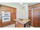 Kitchen featuring wood cabinets, granite countertops and stainless steel appliances at 1 Cerchio Basso, Henderson, NV 89011
